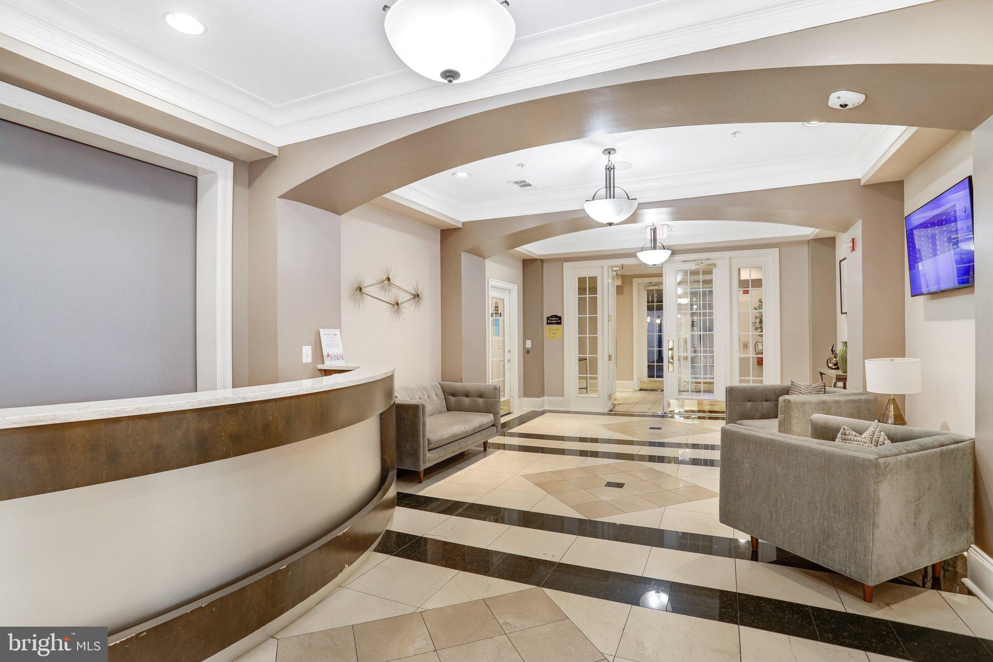 11800 Old Georgetown Road, Unit 1207 North Bethesda, MD 20852 - Photo 52 of 65 a living room with fireplace furniture and a large window