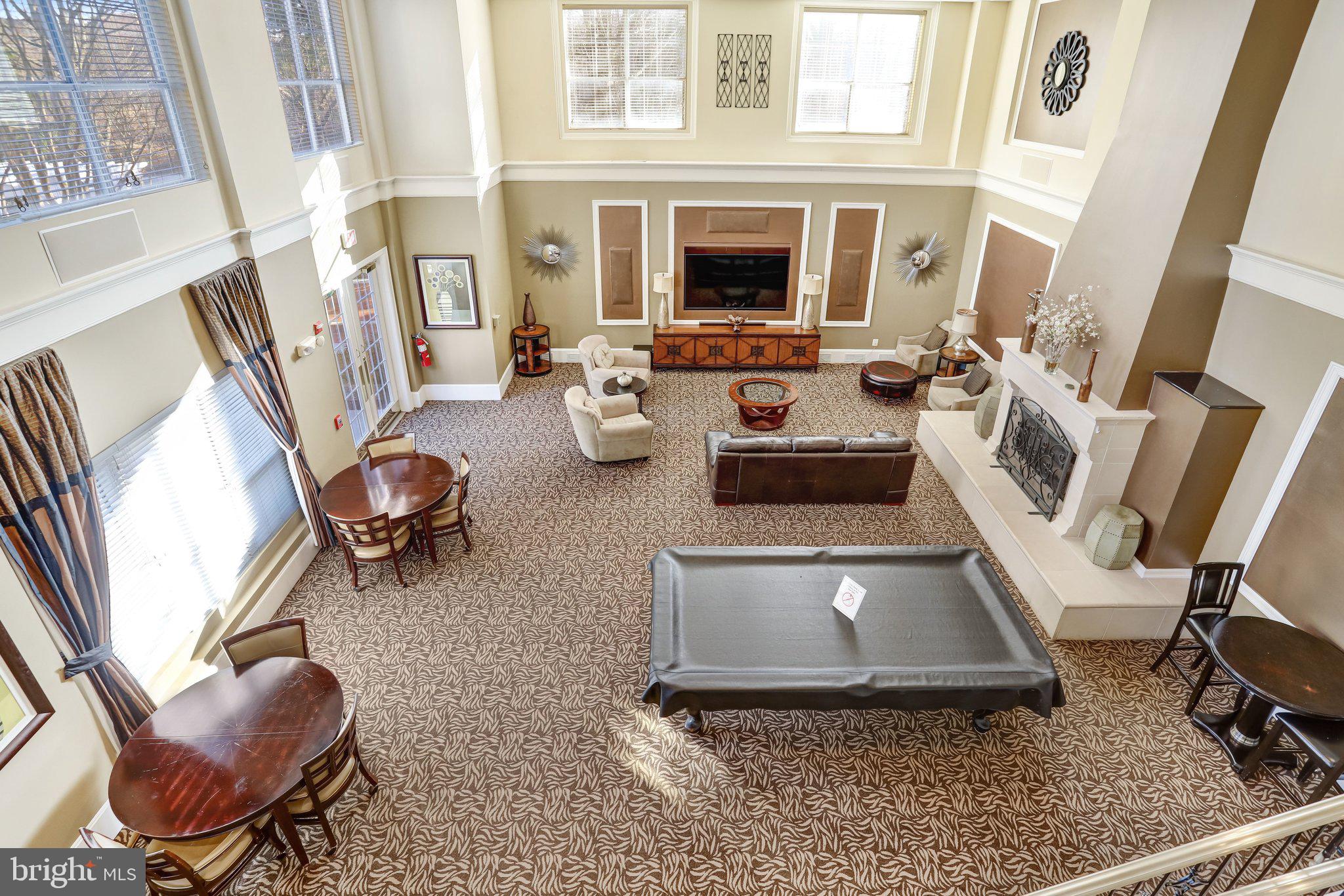 11800 Old Georgetown Road, Unit 1207 North Bethesda, MD 20852 - Photo 55 of 65 a living room with furniture and a fireplace