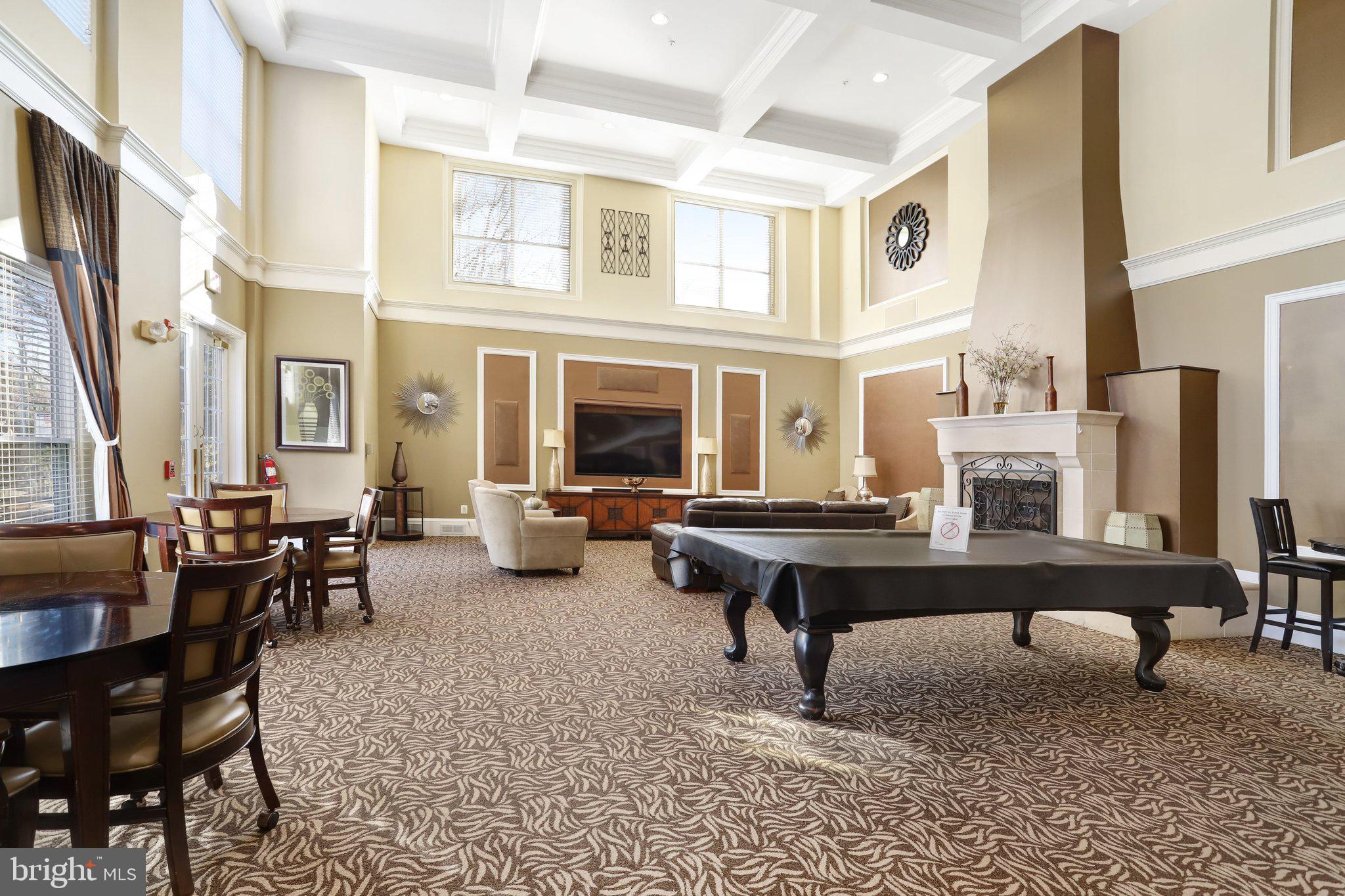 11800 Old Georgetown Road, Unit 1207 North Bethesda, MD 20852 - Photo 57 of 65 a living room with furniture a table and large windows