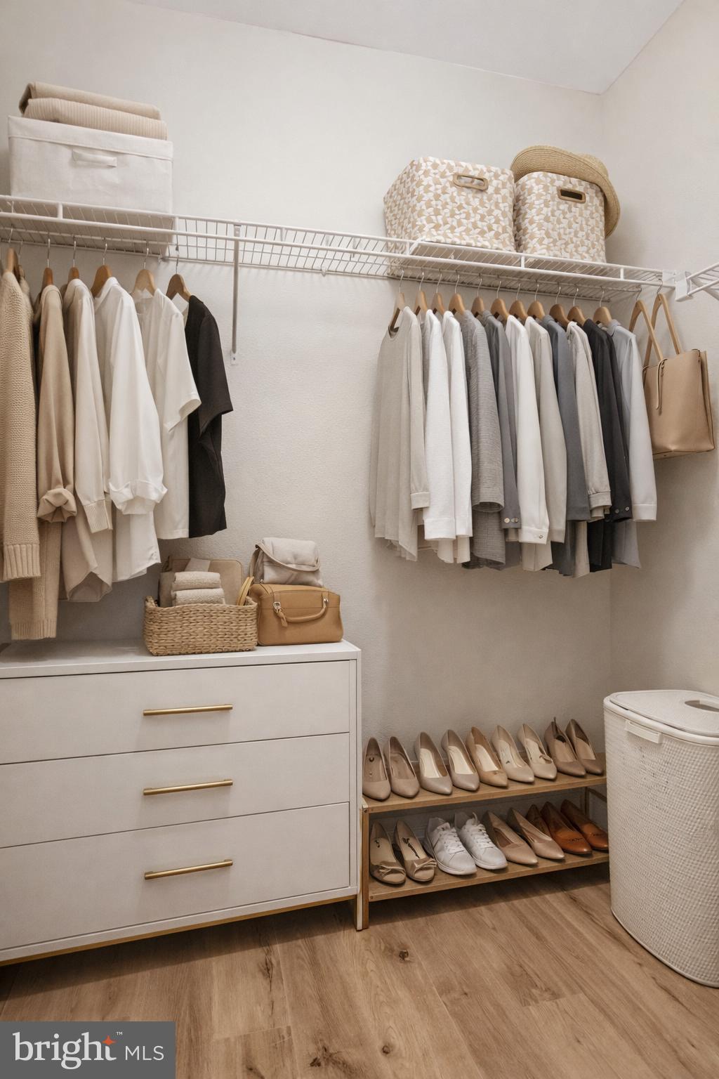 11800 Old Georgetown Road, Unit 1207 North Bethesda, MD 20852 - Photo 7 of 65 a view of walk in closet with clothes and shoes