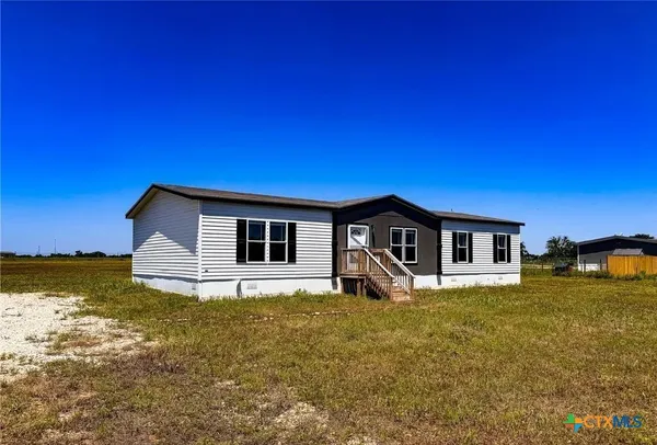 a house with yard in front of it