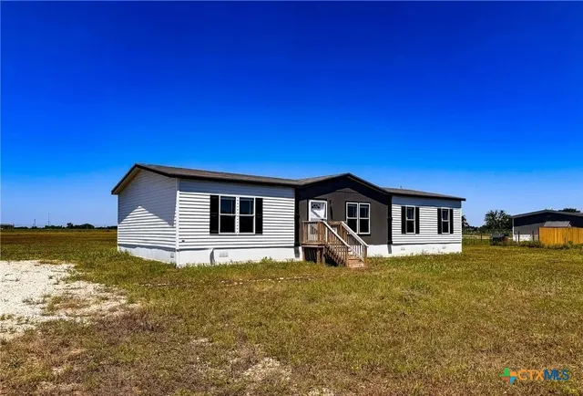 a house with yard in front of it