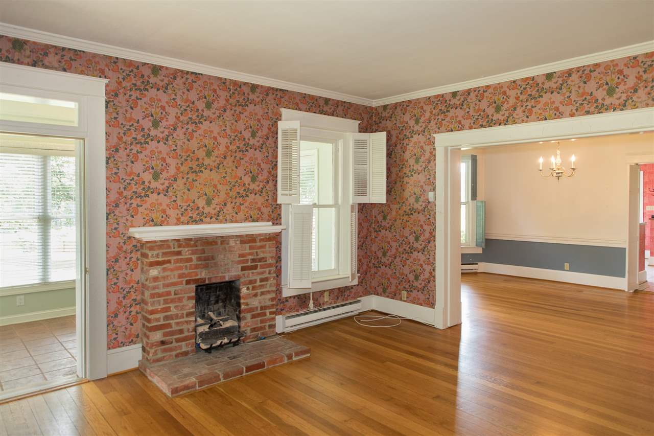395 Kindig Road Waynesboro, VA 22980 - Photo 19 of 45 a view of a livingroom with wooden floor and a fireplace
