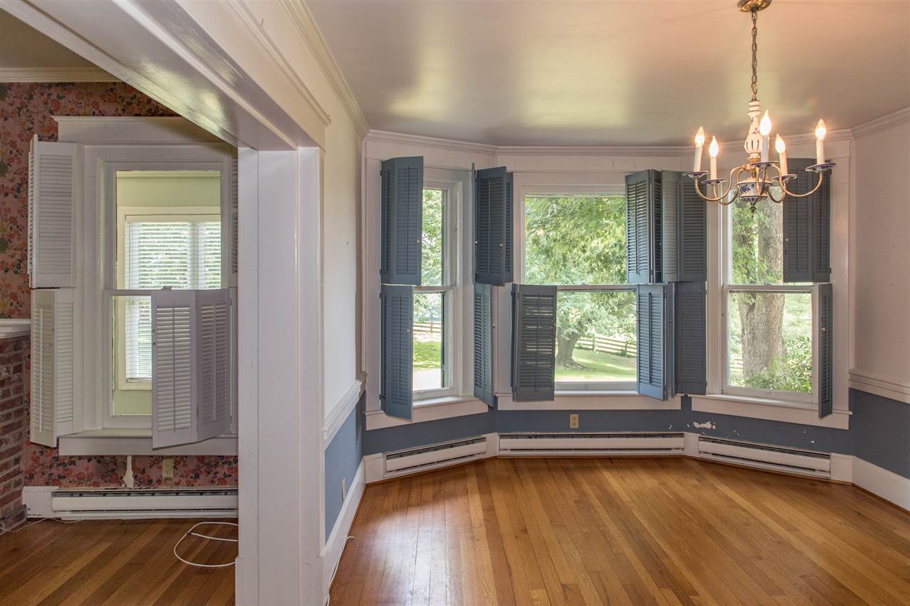 395 Kindig Road Waynesboro, VA 22980 - Photo 10 of 45 a view of an empty room with a window and wooden floor