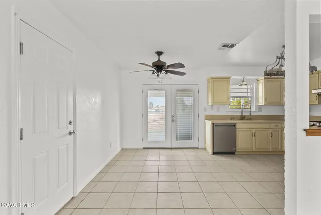 a view of a kitchen with a sink and cabinet