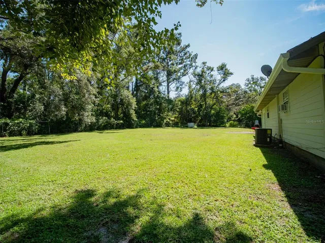 a view of a living room and floor to ceiling window