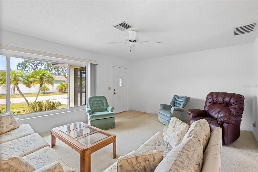 420 Duke Road Venice, FL 34293 - Photo 11 of 22 a living room with furniture and a window