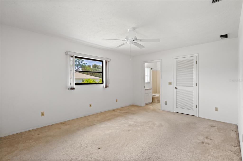 420 Duke Road Venice, FL 34293 - Photo 12 of 22 a view of an empty room with window