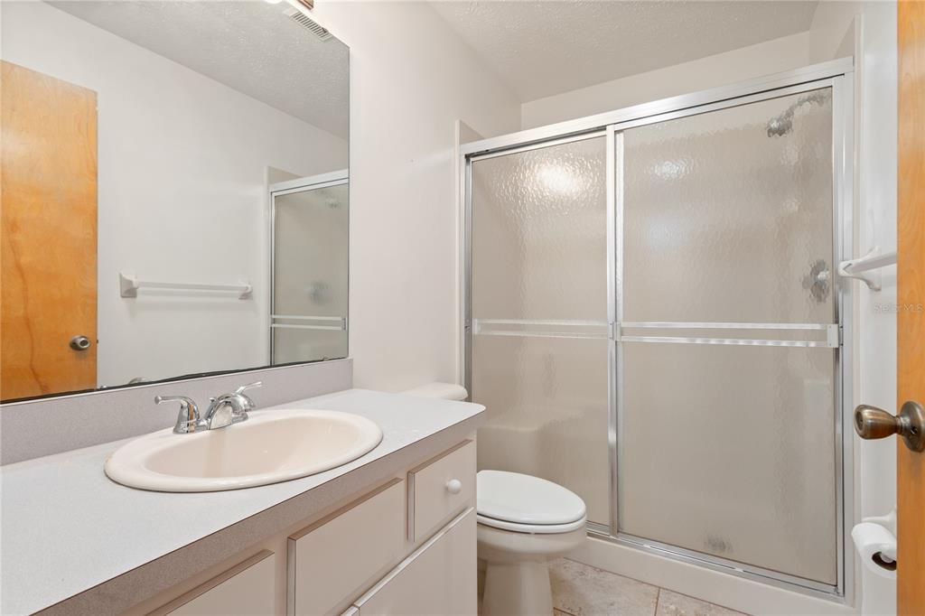 420 Duke Road Venice, FL 34293 - Photo 13 of 22 a bathroom with a sink toilet and shower