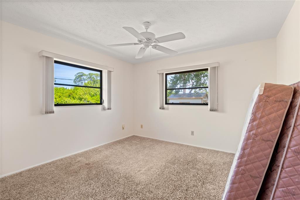 420 Duke Road Venice, FL 34293 - Photo 14 of 22 a view of room with window and ceiling fan