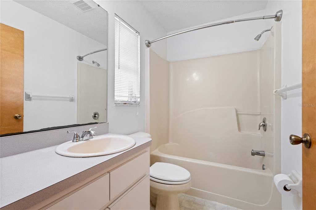 420 Duke Road Venice, FL 34293 - Photo 16 of 22 a bathroom with a granite countertop sink toilet and shower