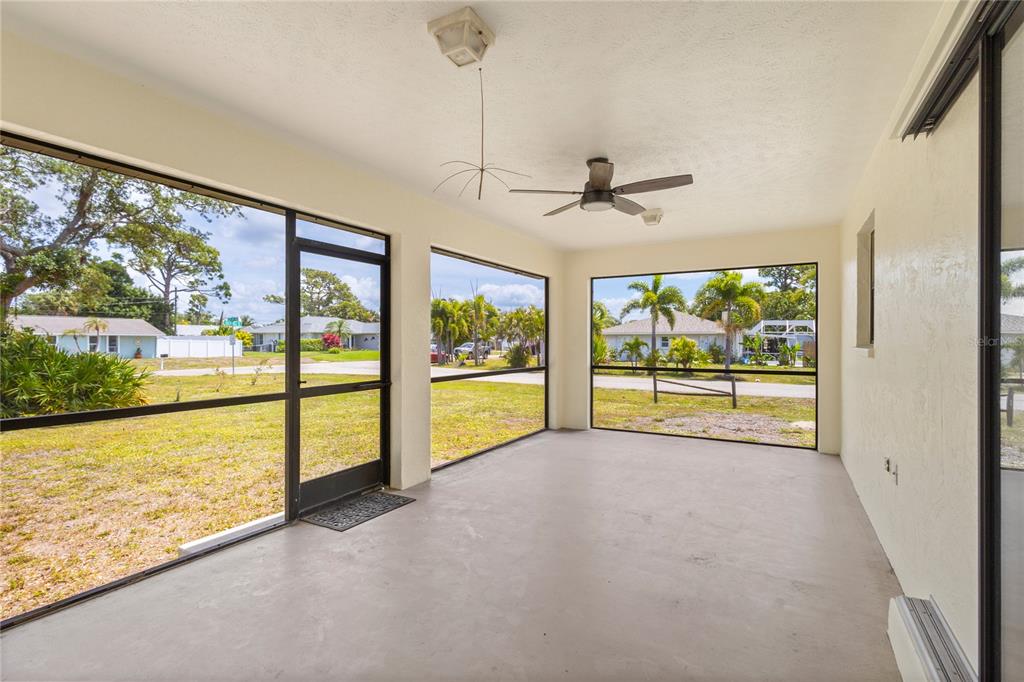 420 Duke Road Venice, FL 34293 - Photo 17 of 22 a view of an empty room with a large window with kitchen view