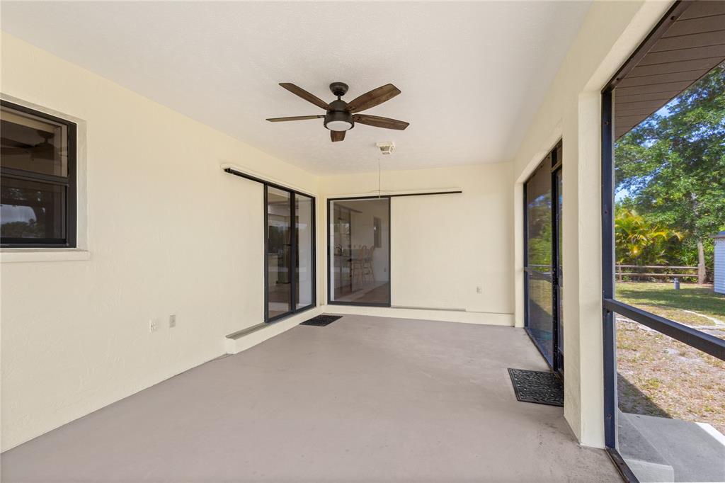 420 Duke Road Venice, FL 34293 - Photo 19 of 22 a view of a livingroom with a ceiling fan and window