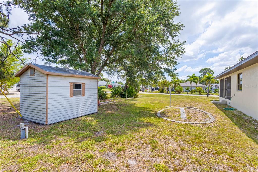 420 Duke Road Venice, FL 34293 - Photo 20 of 22 a view of a backyard with large tree