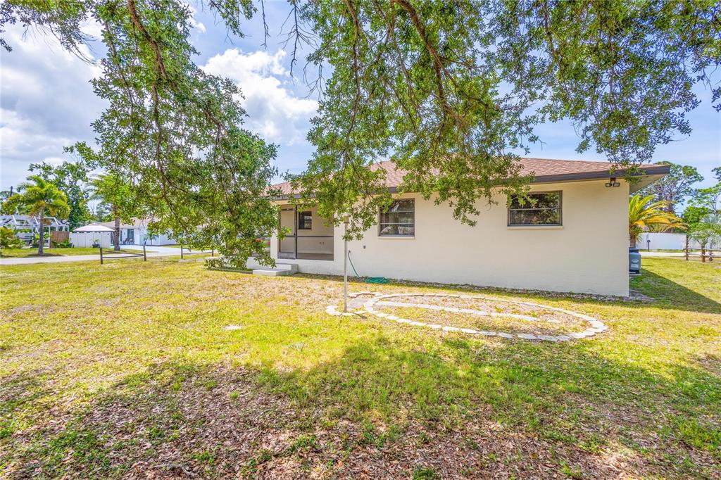 420 Duke Road Venice, FL 34293 - Photo 21 of 22 a view of a house with a yard and a tree