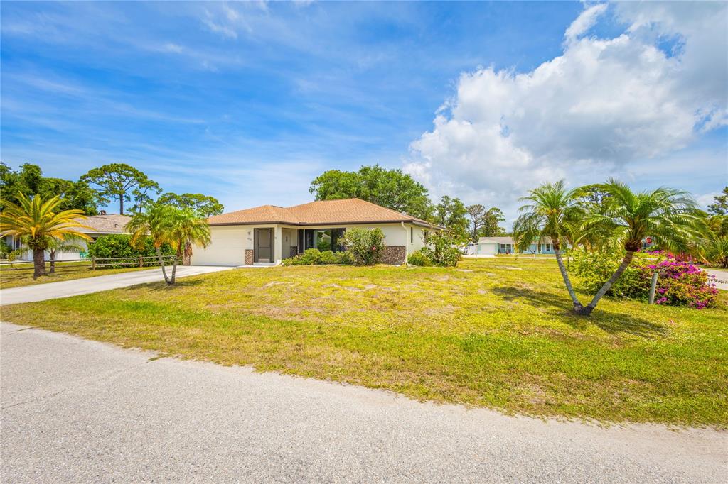 420 Duke Road Venice, FL 34293 - Photo 3 of 22 a house view with swimming pool in front of it