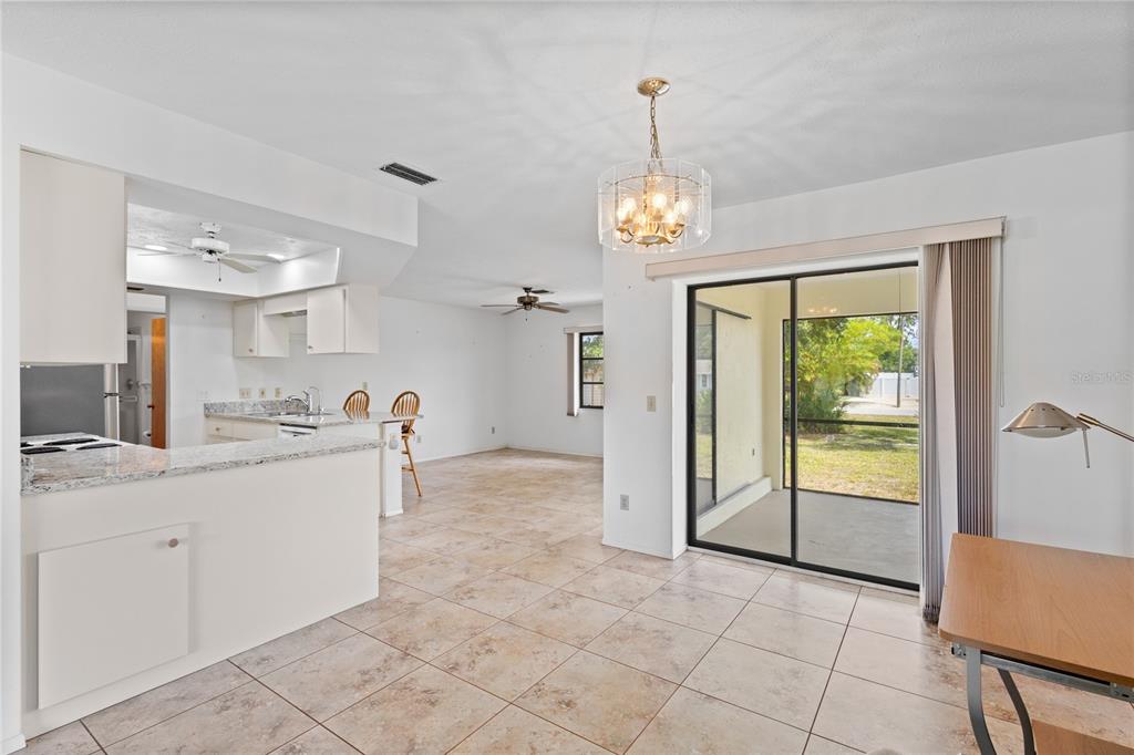 420 Duke Road Venice, FL 34293 - Photo 6 of 22 a view of a kitchen center island and living room view