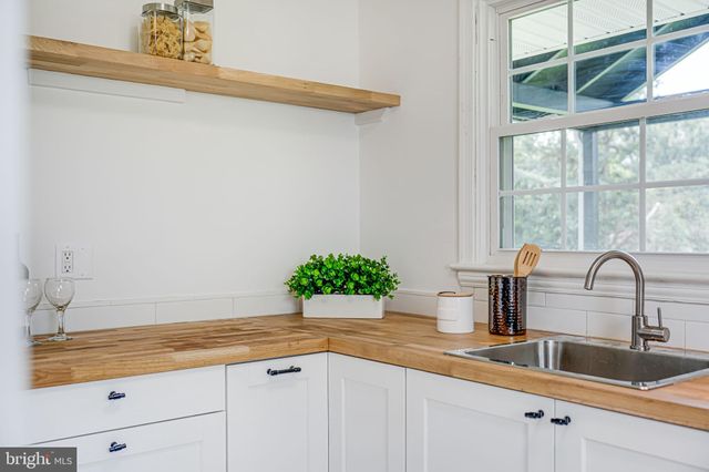 a kitchen with a sink and a window