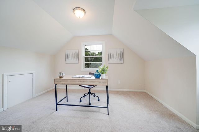 a workspace with furniture and window