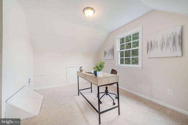 a view of a workspace with furniture