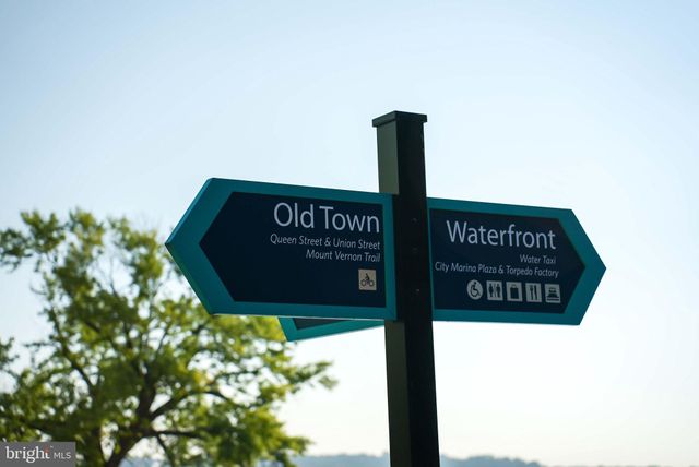a view of swimming pool with outdoor seating and plants