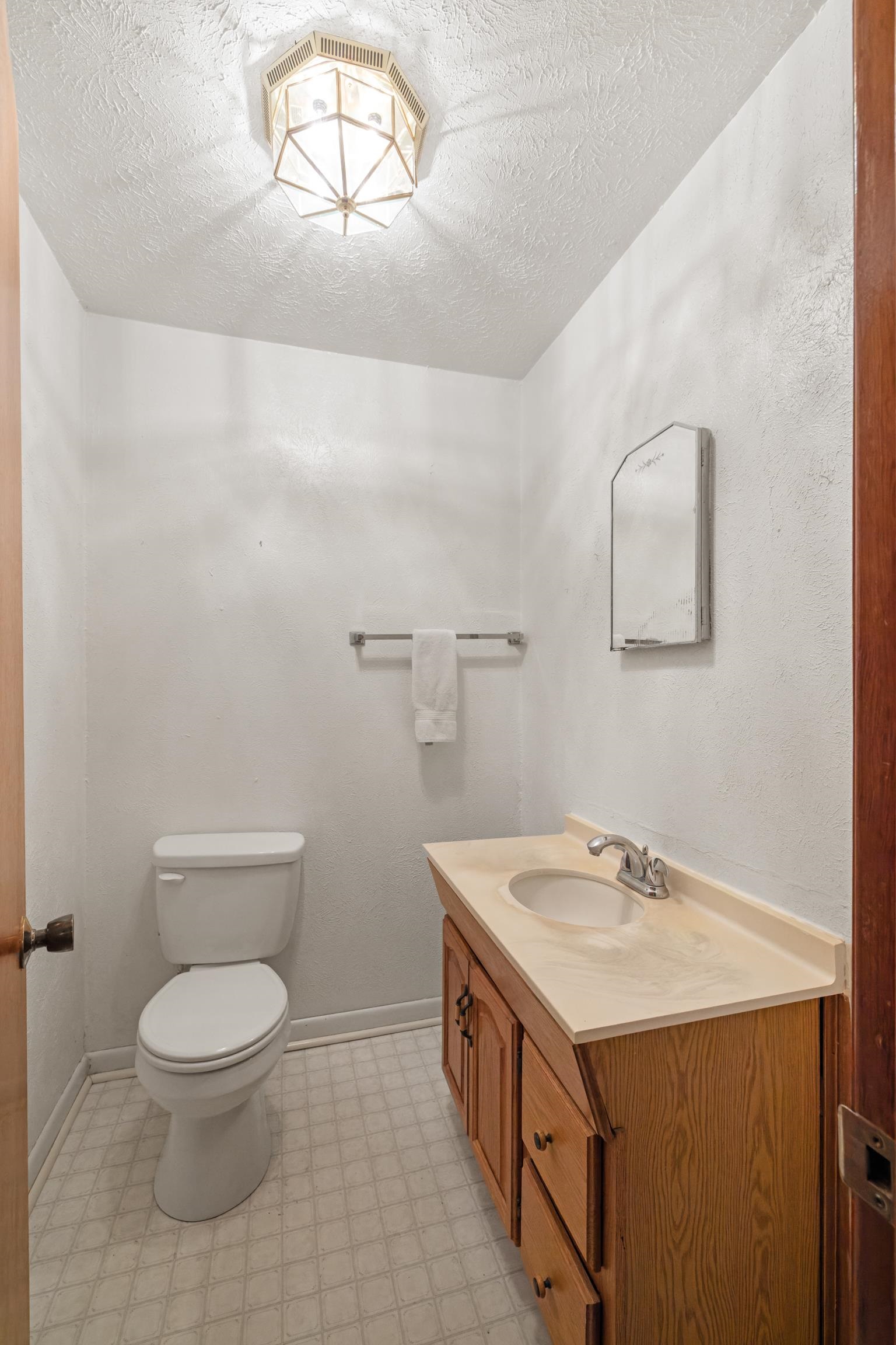 2106 Laurel Hill Road Staunton, VA 24401 - Photo 11 of 46 a bathroom with a toilet a sink and mirror