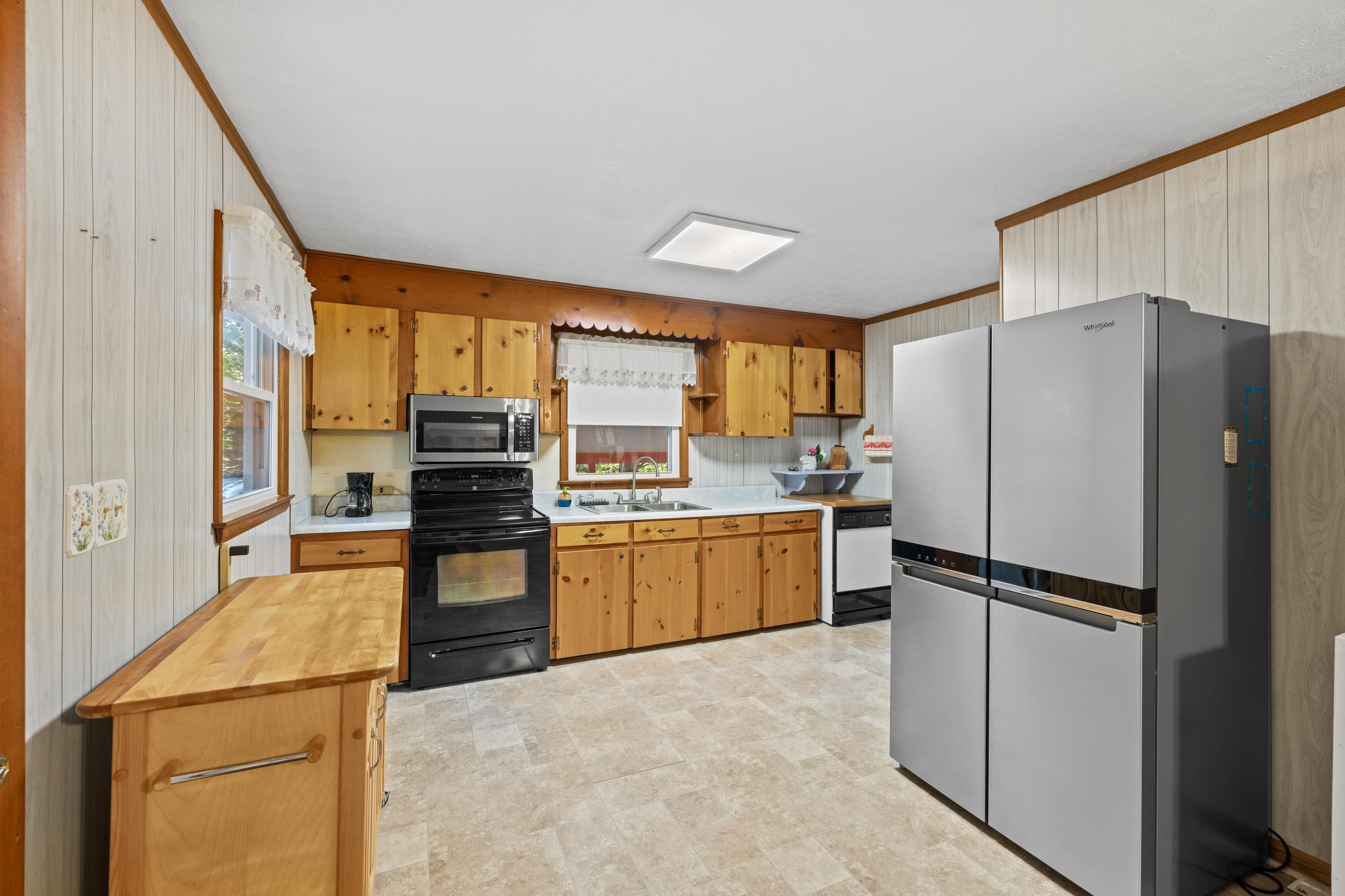 2106 Laurel Hill Road Staunton, VA 24401 - Photo 6 of 46 a kitchen with a refrigerator and a stove top oven