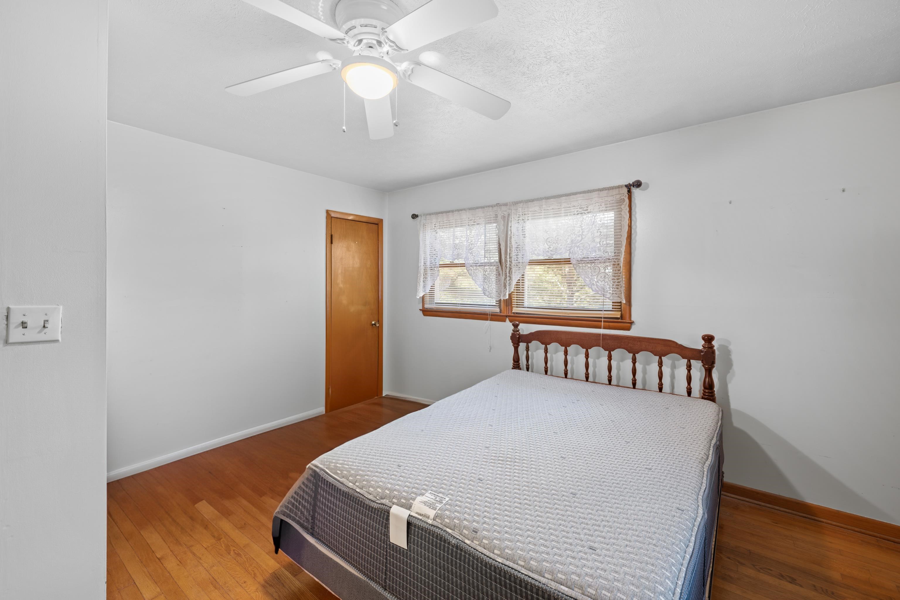 2106 Laurel Hill Road Staunton, VA 24401 - Photo 9 of 46 a bedroom with a bed and window