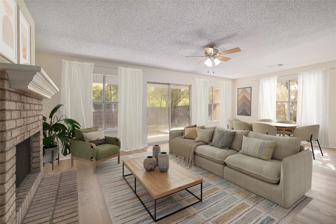 2229 Jasmine Path Round Rock, TX 78664 - Photo 1 of 28 a living room with furniture and a fireplace