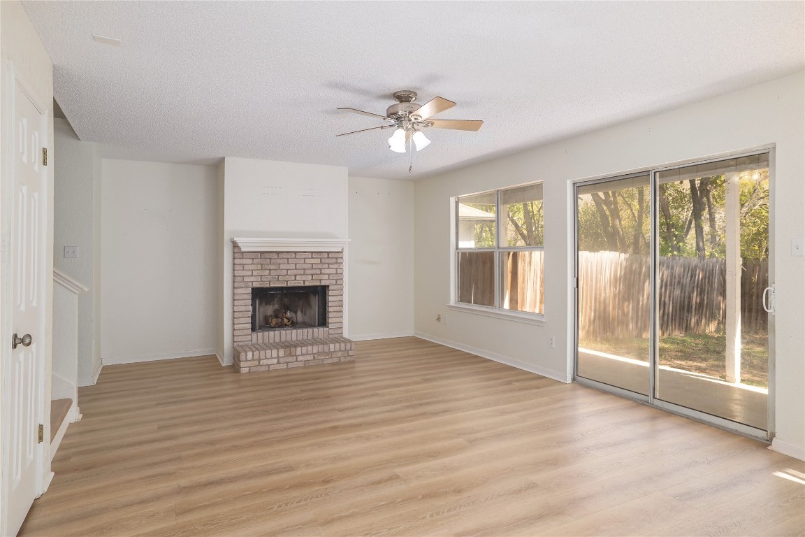 2229 Jasmine Path Round Rock, TX 78664 - Photo 12 of 28 a view of an empty room with a window and wooden floor