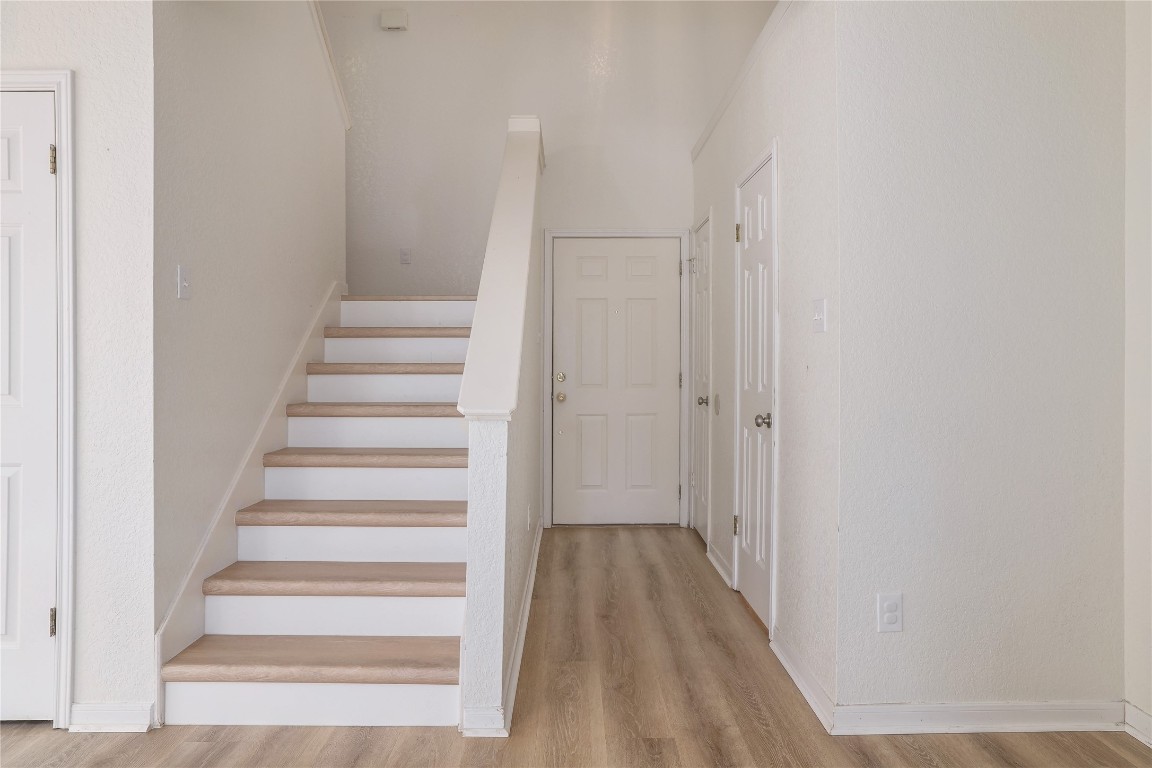 2229 Jasmine Path Round Rock, TX 78664 - Photo 14 of 28 a view of a hallway with wooden floor and entryway