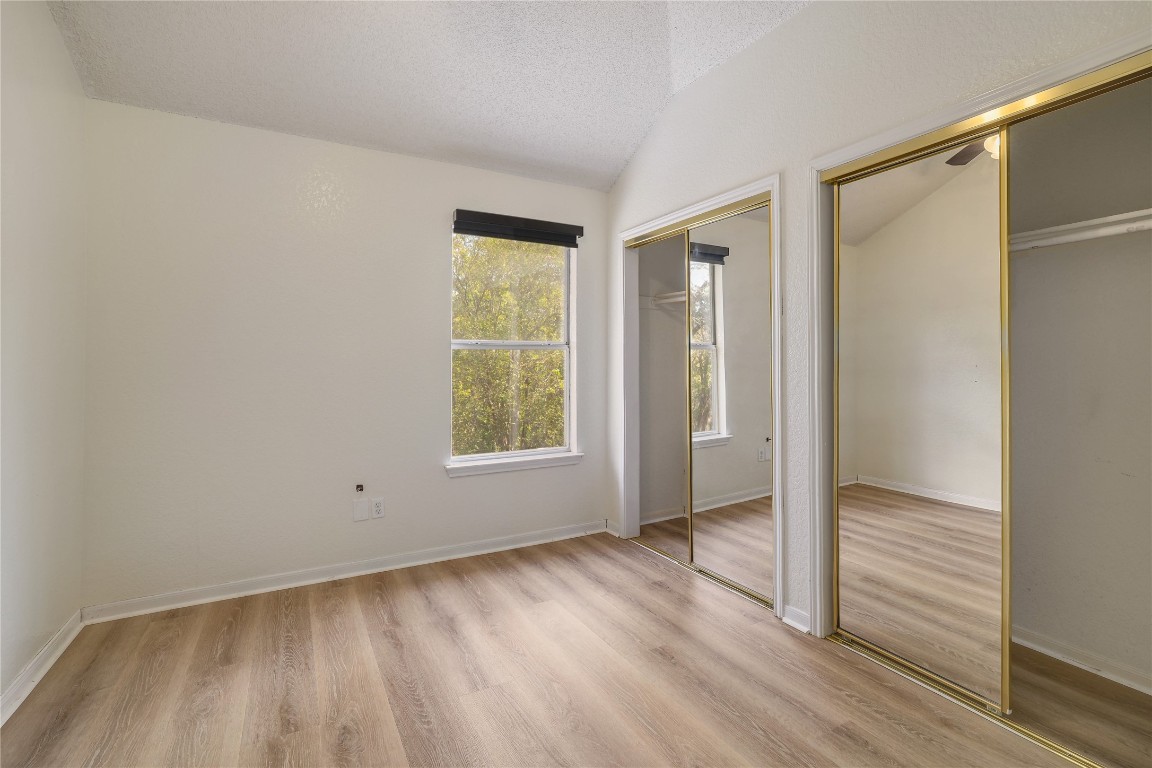 2229 Jasmine Path Round Rock, TX 78664 - Photo 18 of 28 an empty room with wooden floor and a window