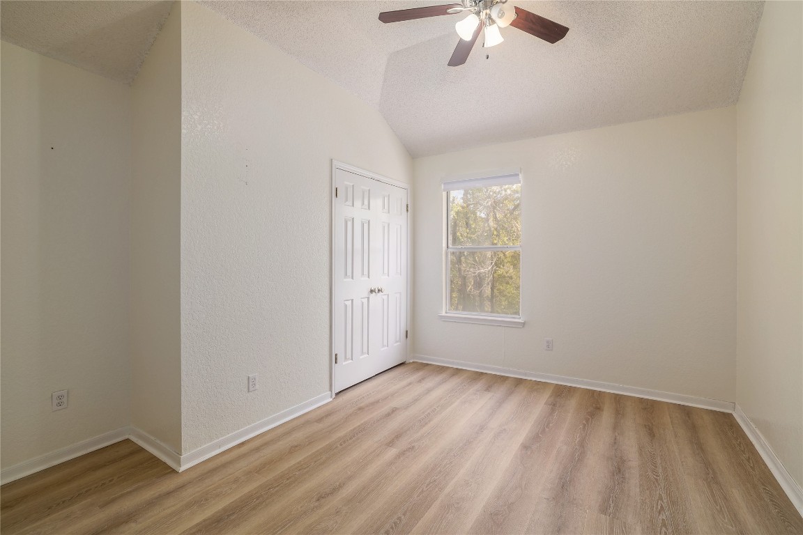 2229 Jasmine Path Round Rock, TX 78664 - Photo 19 of 28 wooden floor in an empty room with a window