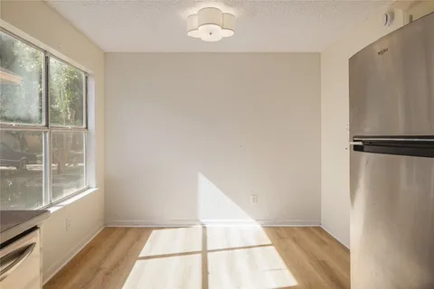 a view of a hardwood floor in a room