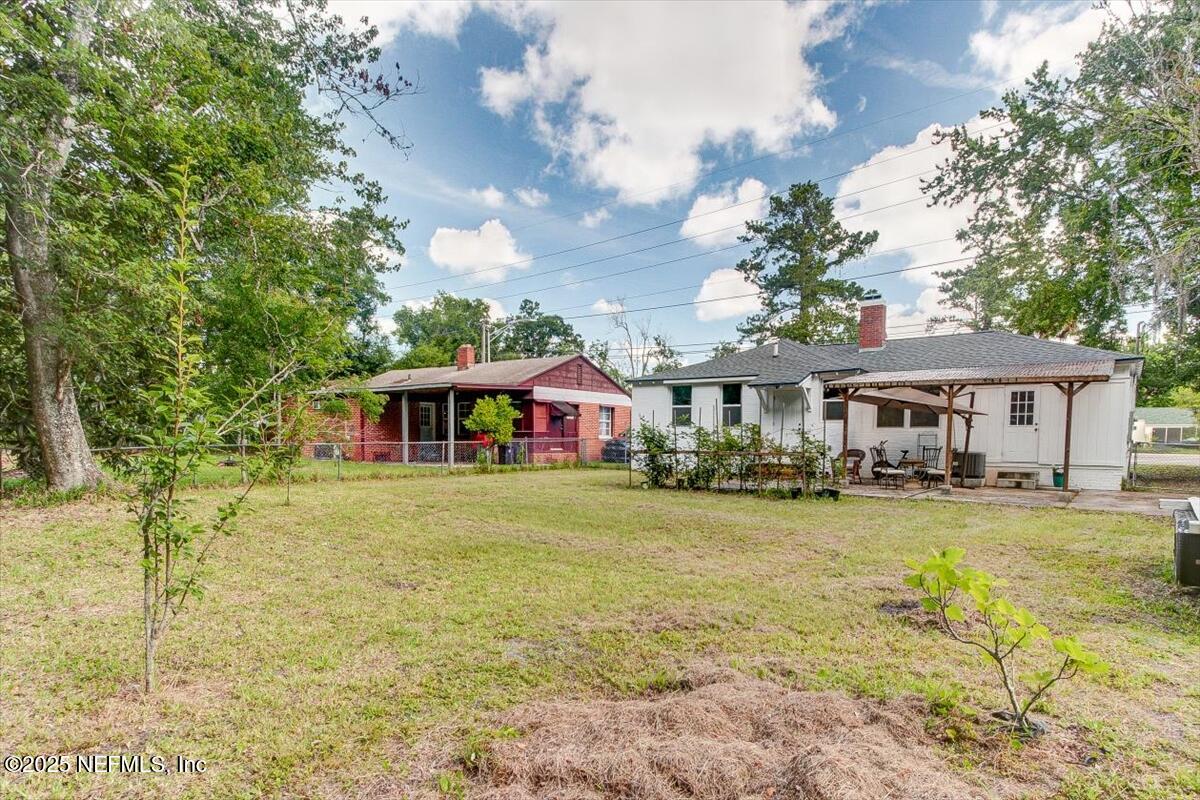 4636 Timuquana Road Jacksonville, FL 32210 - Photo 18 of 21 a front view of a house with garden