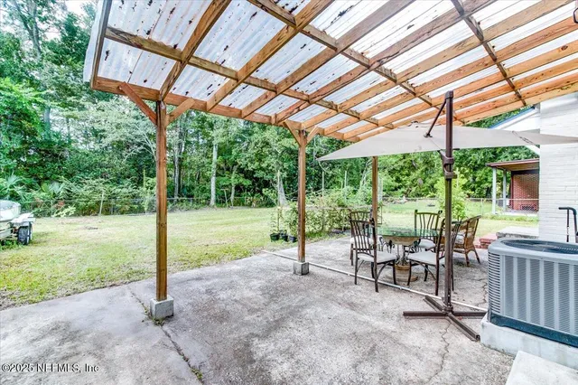 a view of a patio with a backyard