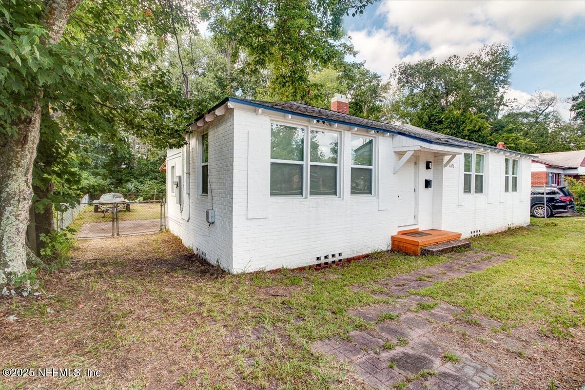 4636 Timuquana Road Jacksonville, FL 32210 - Photo 2 of 21 a view of a house with backyard and sitting area
