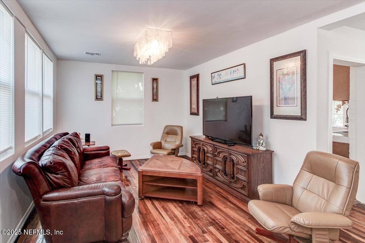 4636 Timuquana Road Jacksonville, FL 32210 - Photo 4 of 21 a living room with furniture and a flat screen tv