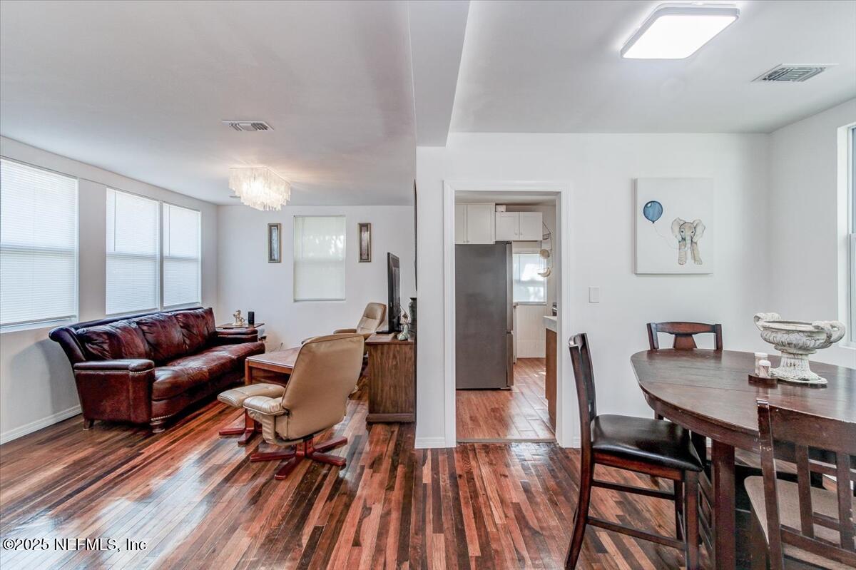 4636 Timuquana Road Jacksonville, FL 32210 - Photo 9 of 21 a living room with furniture and a wooden floor