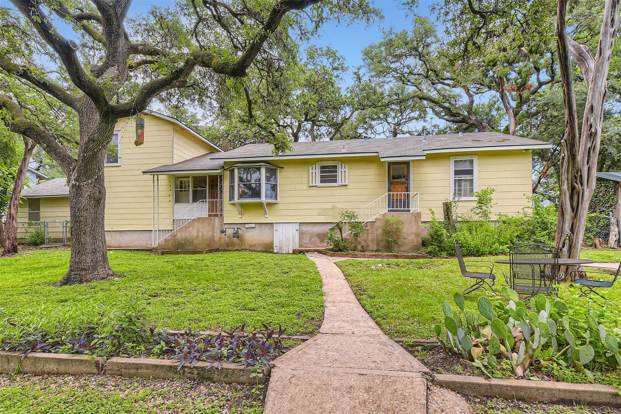 6804 Vine Street Austin, TX 78757 - Photo 14 of 15 front view of a house with a yard