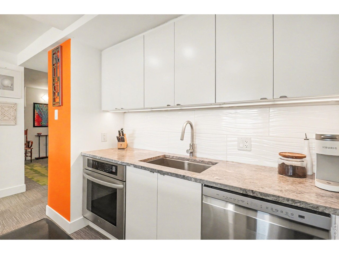1020 15th Street, Unit 32L Denver, CO 80202 - Photo 14 of 32 a kitchen with appliances cabinets and a sink