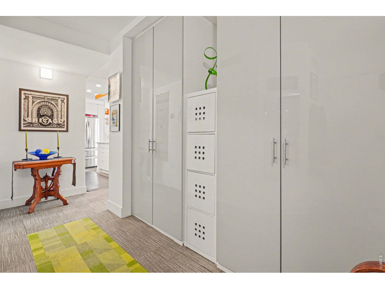 1020 15th Street, Unit 32L Denver, CO 80202 - Photo 16 of 32 a view of a hallway with wooden floor and chair