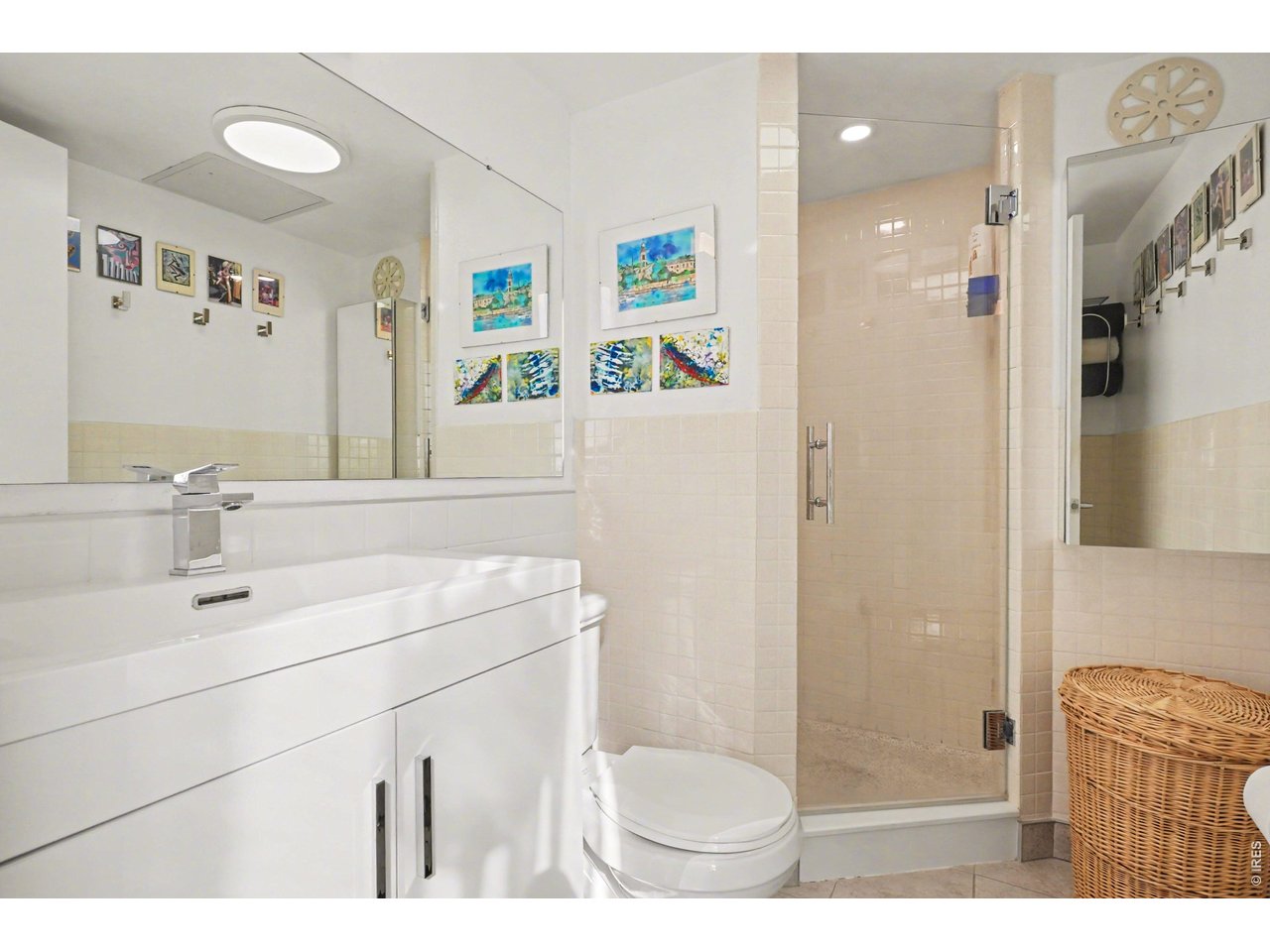 1020 15th Street, Unit 32L Denver, CO 80202 - Photo 22 of 32 a bathroom with a sink toilet a mirror and shower
