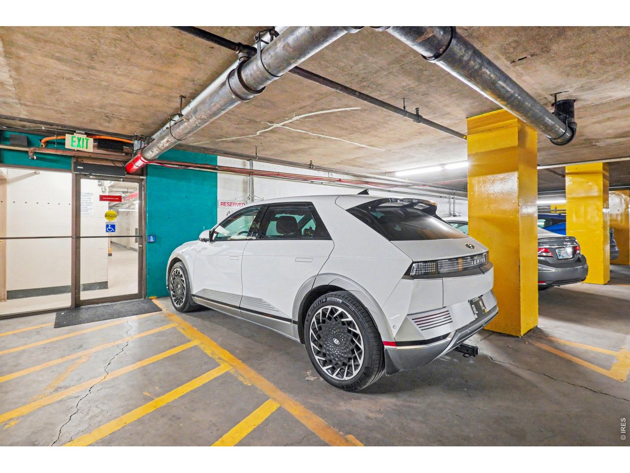 1020 15th Street, Unit 32L Denver, CO 80202 - Photo 29 of 32 a car parked in front of a building