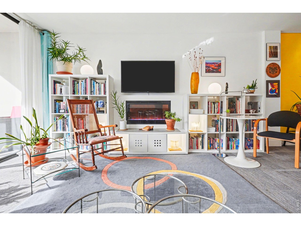 1020 15th Street, Unit 32L Denver, CO 80202 - Photo 6 of 32 a living room with furniture fireplace and flat screen tv