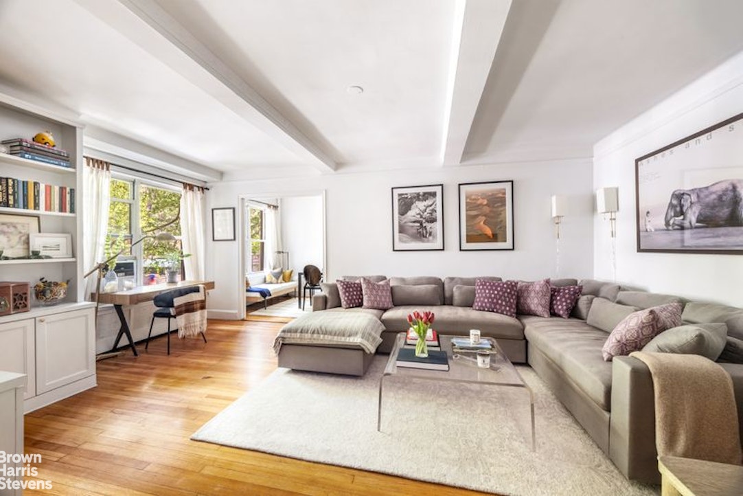 12 East 97th Street, Unit 2G Manhattan, NY 10128 - Photo 1 of 7 a living room with furniture or couch and a window