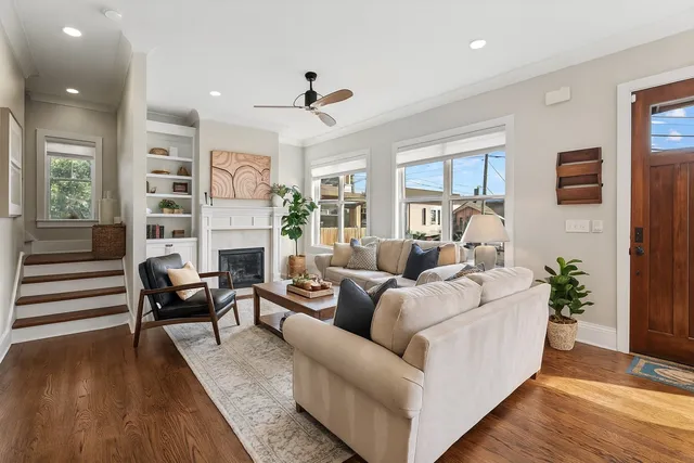 a living room with furniture and a fireplace