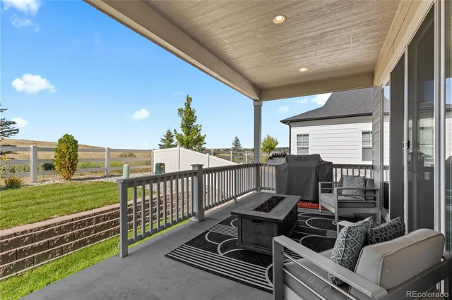 a view of a balcony with chairs