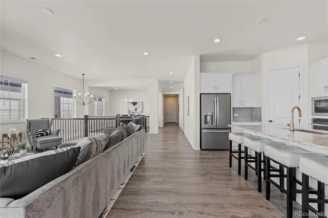 a large kitchen with stainless steel appliances lots of counter space and breakfast area