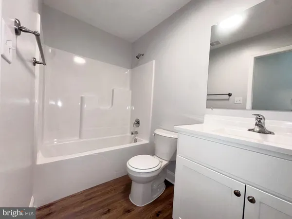 a bathroom with a toilet a sink and a bathtub